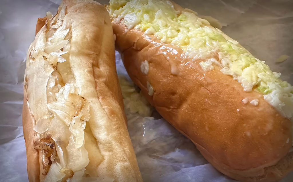 Slaw dog and kraut dog with tender buns